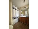 Bright bathroom with a shower-tub combination and vanity at 2390 Coach Way, Jonesboro, GA 30236