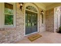 Inviting front entryway with double doors and stylish lighting fixtures at 360 Hannaford Dr, Roswell, GA 30075