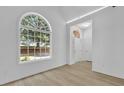 Bright entryway showcasing an arched window and pristine white walls at 1249 Creek Forest Ln # Bldg 8, Austell, GA 30106