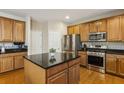 Well-equipped kitchen with granite countertops, stainless steel appliances, and an island at 173 Northshore Xing, Dallas, GA 30157