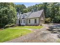 Attractive two-story home featuring a well-manicured lawn and a side-entry garage at 186 Fernleaf Lane Ln, Marietta, GA 30068