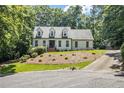 Beautiful two-story home with a well-maintained lawn and lovely landscaping at 186 Fernleaf Lane Ln, Marietta, GA 30068