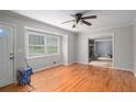 Bright living room featuring hardwood floors, large windows, and an open layout at 60 Newton Ridge Dr, Covington, GA 30014