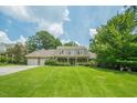 Well maintained home with lush green lawn and mature trees at 2814 Tanner Lake Nw Trl, Marietta, GA 30064
