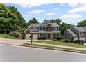 Lovely two-story home with a two-car garage and manicured landscaping at 7090 River Island Cir, Buford, GA 30518