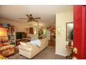Inviting living room with a ceiling fan, plush sofa, and seamlessly connects to a kitchen area at 177 Rustin Dr, Dallas, GA 30157