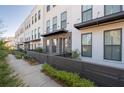 Charming townhome exteriors featuring brick accents and fenced front patios create curb appeal at 852 Constellation Dr, Decatur, GA 30033