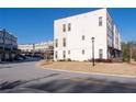 A view of the community street, lined with modern townhomes, showcases a well-planned neighborhood at 852 Constellation Dr, Decatur, GA 30033