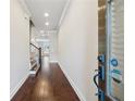 Welcoming entryway featuring hardwood floors and views of staircase and other rooms at 2058 Glenview Park Cir, Duluth, GA 30097