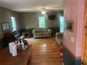 Inviting living room with hardwood floors, a ceiling fan, and natural light from the windows at 245 Jesse Mccollum Dr, Canton, GA 30114