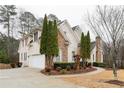 Elegant two-story home boasting a brick and stone facade, a spacious driveway, and meticulously landscaped grounds at 1360 Mount Mickinley Dr, Grayson, GA 30017