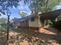 A close-up of the home showcasing a covered carport and vintage architectural details at 1722 Donnalee Se Ave, Atlanta, GA 30316
