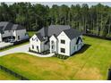 Charming two-story home with a long driveway and green lawn at 3207 Bold Springs Rd, Dacula, GA 30019