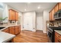 Well-lit kitchen featuring wood cabinets, stainless steel appliances, and lots of counter space at 429 Mountain View Ln, Woodstock, GA 30188