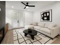 Cozy living room with a sectional sofa, fireplace, and doors to the outside at 32 Wadley Nw St, Atlanta, GA 30314