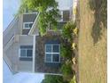 Charming two-story home with stone accents, landscaping, and inviting front entrance at 4480 Merrigold Way, Fairburn, GA 30213