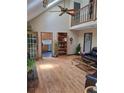 Open living room boasts soaring ceilings, hardwood floors, and an open view of the upper level at 1131 Steeple Run, Lawrenceville, GA 30043