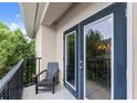 Relaxing outdoor balcony featuring a chair and views of the surrounding trees and natural light at 1850 Cotillion Dr Unit 3416, Atlanta, GA 30338