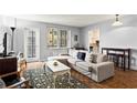 Comfortable living room features neutral colors and a balcony at 300 Peachtree Ne St # 20 O, Atlanta, GA 30308