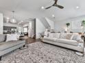 This open-concept living room is perfect for entertaining, featuring hardwood floors and stylish decor at 499 Bishop Ln, Woodstock, GA 30188