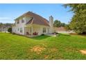 Expansive backyard featuring a well-maintained lawn and patio area with outdoor seating at 3419 Allie Dr, Snellville, GA 30039