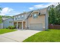 Two-story home with attached garage, stone accents, well maintained lawn, and mature landscaping at 588 Joneus Dr, Mcdonough, GA 30252