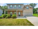 Charming two-story home with stone accents, covered porch, lush lawn and mature landscaping at 588 Joneus Dr, Mcdonough, GA 30252