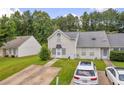 Charming home with inviting exterior, driveway, green lawn, and plenty of parking at 6178 Field Stone Dr, Douglasville, GA 30134