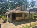 Quaint single-story home with a covered porch and neutral-tone exterior at 718 South Ave, Forest Park, GA 30297