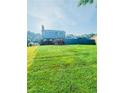 Expansive backyard with a deck and privacy fence, providing ample space for relaxation and entertainment at 751 Stonecreek Way, Stone Mountain, GA 30087