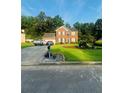 Beautifully landscaped two-story brick home with a well-manicured lawn and inviting curb appeal at 751 Stonecreek Way, Stone Mountain, GA 30087