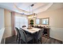 Elegant dining room with modern light fixture, stylish decor, and comfortable seating at 85 Eastwood Frst, Covington, GA 30014