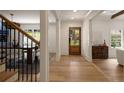 Bright and inviting foyer with hardwood floors and a view of the dining room at 1155 Peachtree Battle Nw Ave, Atlanta, GA 30327
