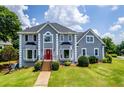 Aerial view of a well-maintained property with a beautiful pool and lush green lawn in a serene neighborhood at 11 Chad Ct, Mcdonough, GA 30253