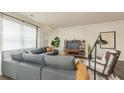 Comfortable living room with a large sectional sofa, accent chair, and natural light from the window at 4946 Jatoba Rd, Acworth, GA 30101