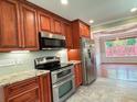 Kitchen featuring granite countertops and stainless steel appliances at 4185 Lenox Park Dr, Buford, GA 30519