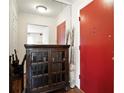 Hallway featuring hardwood floors, a mirror, and an antique cabinet at 6851 Roswell Rd # F5, Sandy Springs, GA 30328