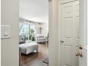 Sun-lit living area with hardwood floors and access to an outdoor balcony at 6851 Roswell Rd # F5, Sandy Springs, GA 30328
