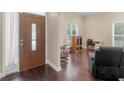 Comfortable living room area featuring hardwood flooring and relaxing furniture at 570 Mcgarity Dr, Mcdonough, GA 30252