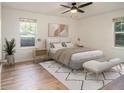 Comfortable bedroom with large windows and hardwood floors at 1150 Collier Nw Rd # A1, Atlanta, GA 30318