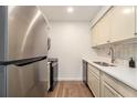 Efficient kitchen features stainless steel appliances and sleek countertops at 1150 Collier Nw Rd # A1, Atlanta, GA 30318