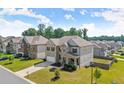 Aerial view of a beautiful brick two-story home in a well-maintained neighborhood at 7410 Ansley View Ln, Cumming, GA 30028