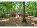 Charming single-story brick home surrounded by lush, mature trees in a peaceful setting at 80 Cliffcreek Trce, Atlanta, GA 30350