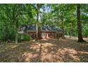 Charming single-story brick home surrounded by lush, mature trees in a peaceful setting at 80 Cliffcreek Trce, Atlanta, GA 30350