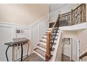 Beautiful staircase with wooden rails and rod iron spindles, leading to a loft at 2355 Woodland Hills Dr, Cumming, GA 30040