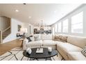Bright and airy living room with ample natural light, a comfortable sectional sofa, and an open floor plan at 1712 Fulmont Cir, Mableton, GA 30126