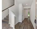 Bright entryway with hardwood floors and staircase at 261 Mahone Dr, Lilburn, GA 30047