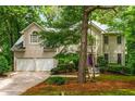Beautiful home with a two-car garage, stucco exterior, and well-maintained landscaping at 1950 Wenlok Ne Trl, Marietta, GA 30066