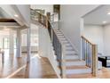 Spacious foyer with staircase featuring wood treads and black iron railing at 2900 Waterford Dr Sw, Conyers, GA 30094