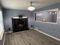 Living room features a stunning black marble fireplace at 110 Stagecoach Trl, Stockbridge, GA 30281